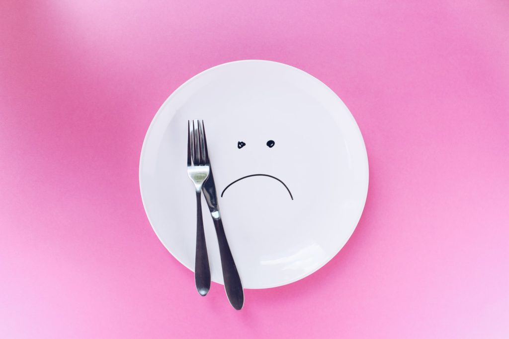 food cravings frown face drawn on plate