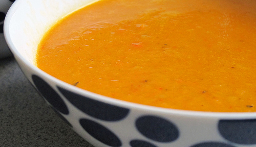 easy microwave carrot ginger soup in blue and white bowl