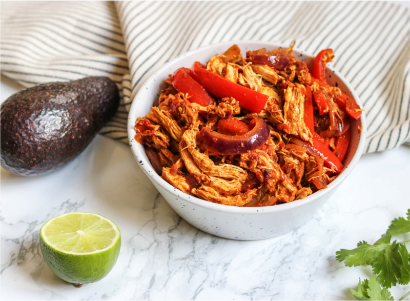 slow cooker chicken fajitas in serving bowl on table
