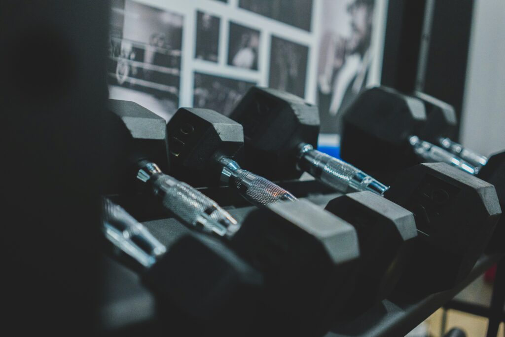 close up of dumbbells on rack waiting for you to get back to the gym